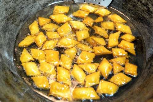 Frying Shankarpali Almost Done